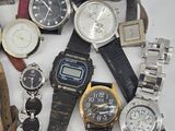 a lot of watches that are sitting on a table