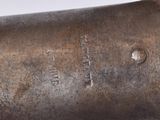 a close up of a metal object on a white surface