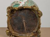 a clock that is sitting on a table