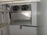 two fans that are on the side of a wall