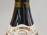 a bottle of wine that is sitting on a table