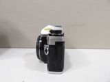 a black camera sitting on a white table