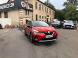a red car parked in front of a building