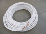 a close up of a bunch of white wires on a floor
