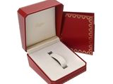 a red box with a ring inside of it on a white surface