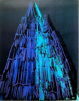 a very tall building lit up with blue lights