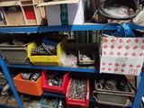 a shelf full of assorted tools in a garage