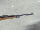 a picture of a rifle that is on the ground