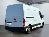 a white van that is parked in a room
