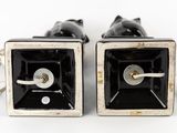 pair of black and silver cufflinks with a cat design