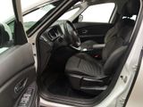 the interior of a car with the door open and the driver ' s seat up