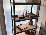 a shelf with various items on it in a room