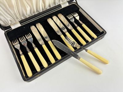 a case with a set of forks and knives in it