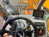 a steering wheel of a construction vehicle on the street