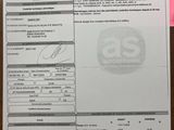 a picture of a receipt on a table with a cell phone
