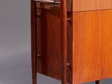 an image of a small wooden cabinet with a drawer