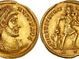 a gold coin with an image of a man holding a sword