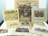 a lot of old photographs on the table