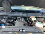 a car engine with the hood open and the hood down