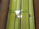 a box with a bunch of yellow sticks inside of it
