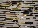 many different types of knives on the table