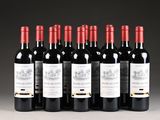 six bottles of red wine lined up in a row