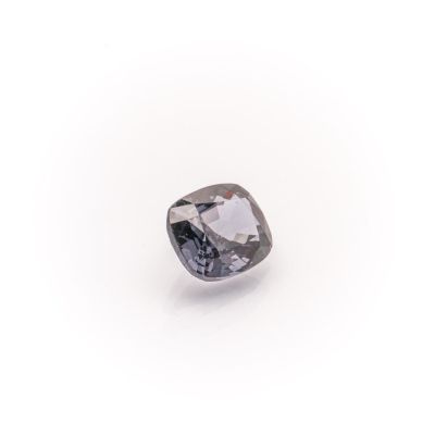 a close up of a diamond on a white surface