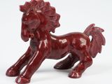figurine of a red horse on a white background