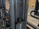 two machines that are sitting in the gym