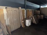 a lot of boxes and boxes of wood in a room