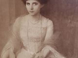 portrait of a woman in a white dress sitting on a chair