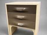 a close up of a wooden chest of drawers with three drawers