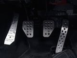 two pedals that are sitting on the floor of a car