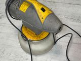 an image of a floor sander on the floor