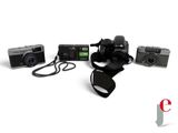 three cameras and a camera strap on a white background