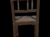 an old wooden chair with beads on the back of it