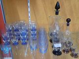 many glasses and a pitcher on the table