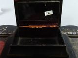 a black box with a tag on it sitting on a table