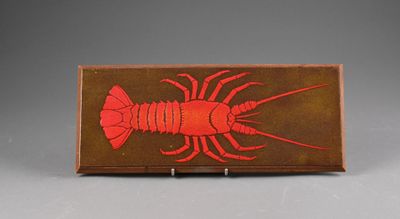 an image of a red lobster on a brown background