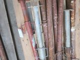 a lot of pipes that are stacked up on a pallet