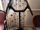 two chairs and a table in the corner of a room