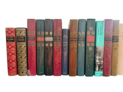 many books that are lined up on a shelf
