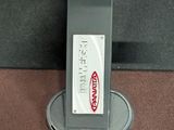 a phone that is sitting on a stand on the floor