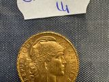a close up of a gold coin with a label on it