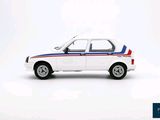 a small white car with a red, white and blue stripe