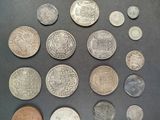 several different coins are arranged in a circle on a table