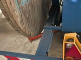 a picture of a forklift with a large piece of wood in the back of it