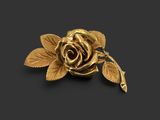 a close up of a gold rose with leaves on a black background
