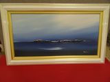 Tableau à l'huile encadré représentant une vue sur l'océan avec un bateau au loin