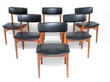 set of six dining chairs with black leather upholstered seats
